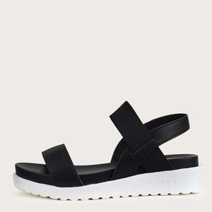 Black platform sandal with white sole. Lightweight. Never worn.